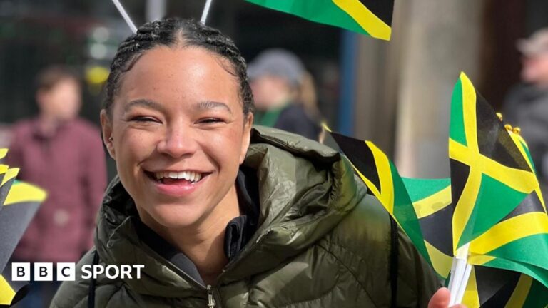 Mica Moore with Jamaica flags.