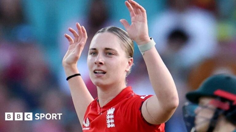 Freya Kemp holds her arms aloft