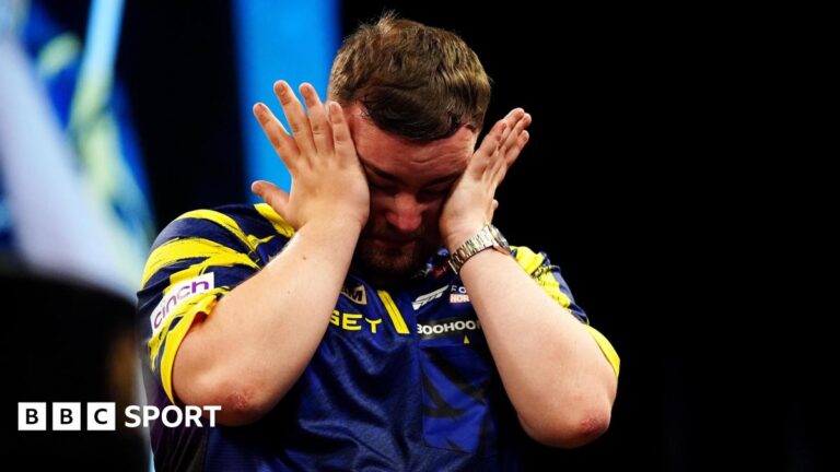 An emotional Luke Littler wipes away tears after beating Luke Humphries to win  the 2026 Premier League Darts