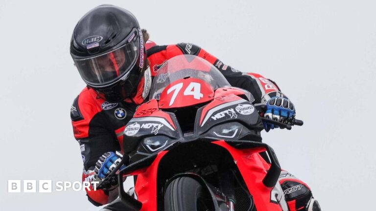 Kamil Holan riding in black and red colours