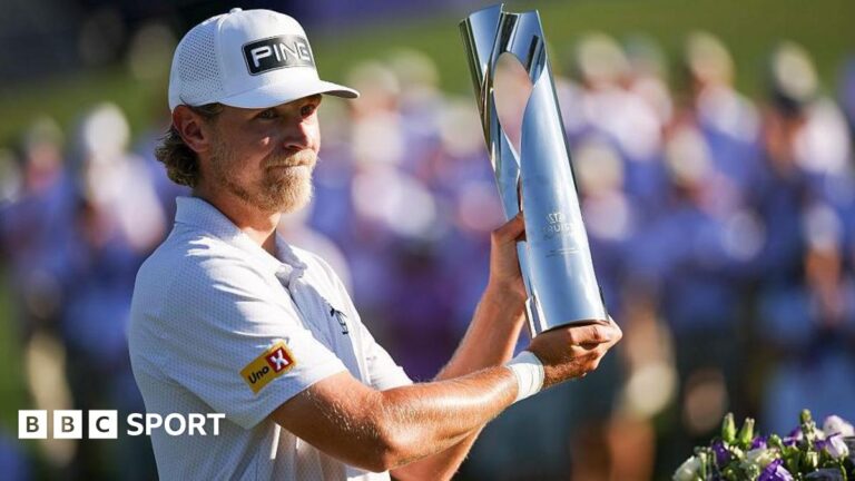 Kristoffer Reitan holding his trophy aloft after winning the Truist Championship in 2026