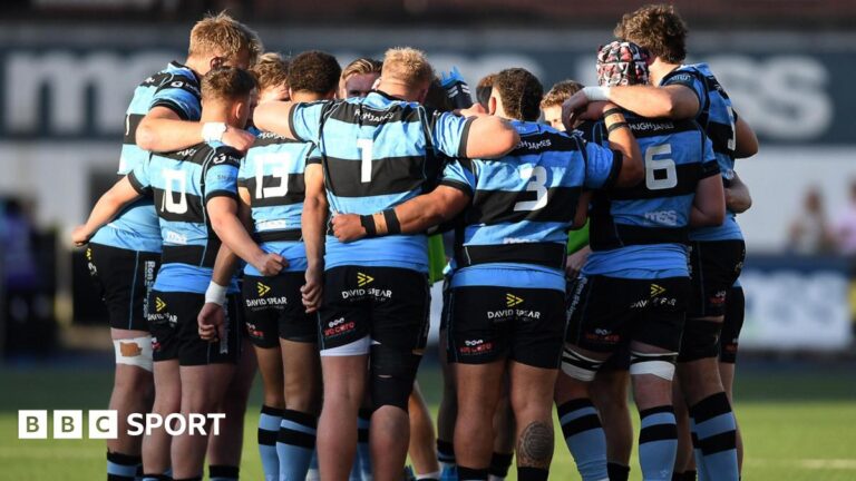 Cardiff players in a huddle
