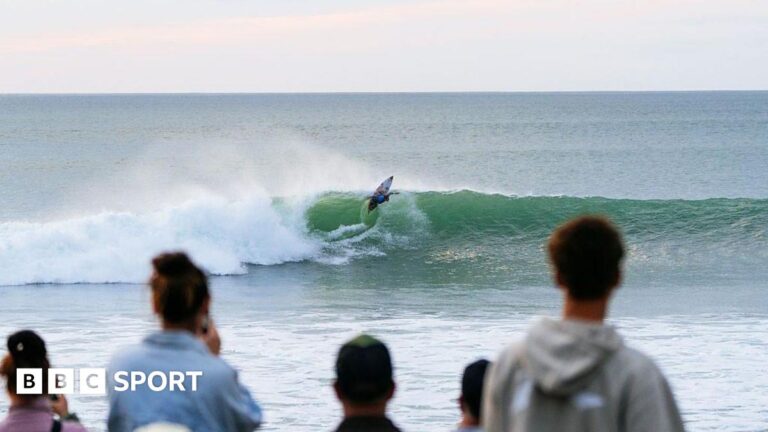 Fans watch surfers at Raglan in New Zealand