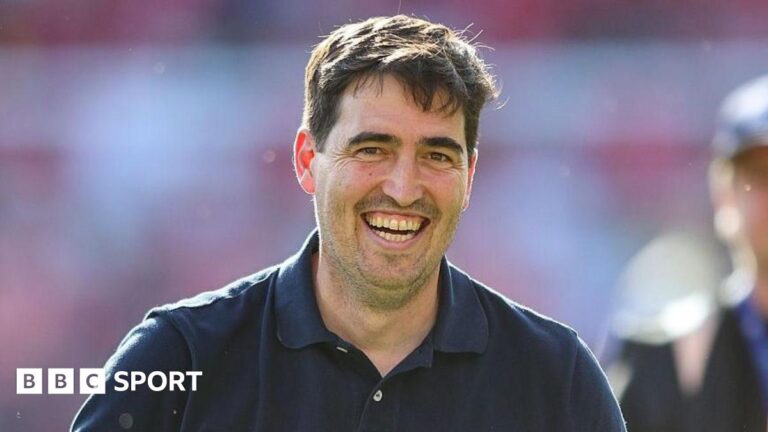 Bournemouth boss Andoni Iraola smiles on the touchline