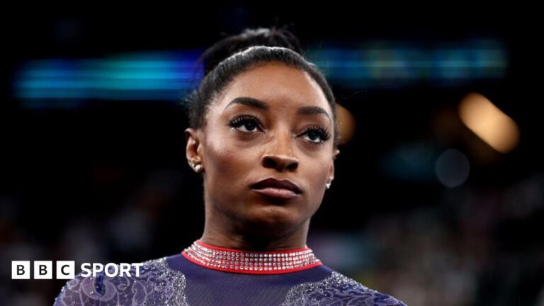 A close up of Simone Biles' face prior to competing in the artistic gymnastics Women's floor exercise final at the 2024 Olympics