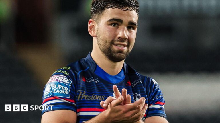 Wakefield Trinity half-back Jack Sinfield applauds the fans after a win at Hull FC