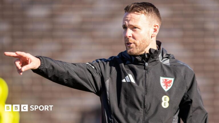 Chris Gunter points during a training session