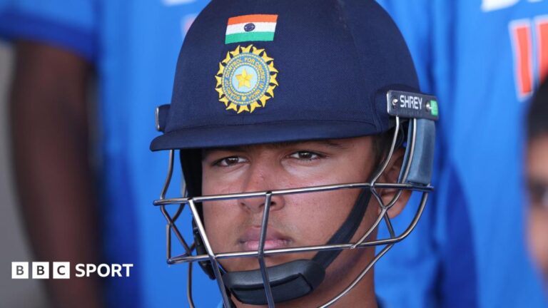 Vaibhav Sooryavanshi wearing an India helmet waiting to bat