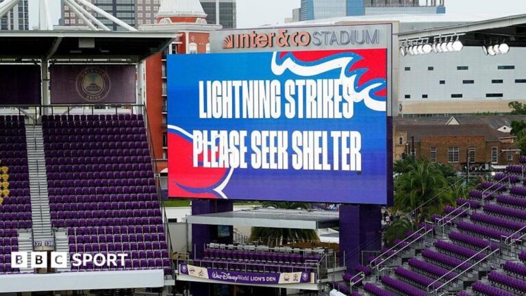 Big screen saying 'lightning strikes please seek shelter'