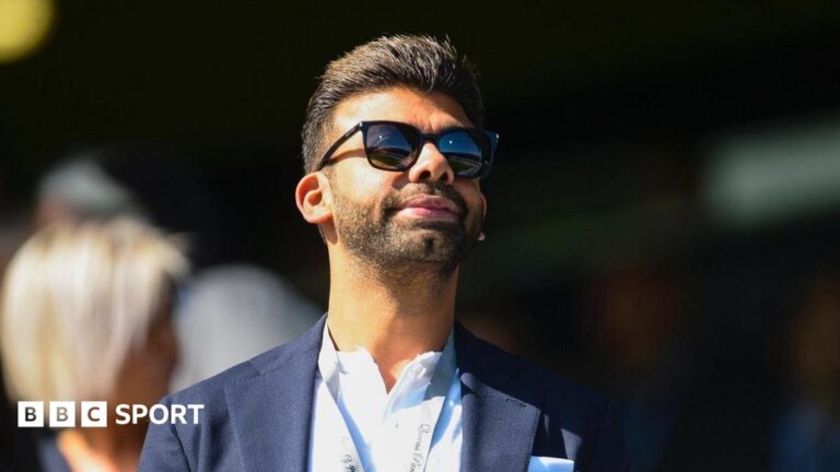 Amit Bhatia looks on from the Loftus Road directors' box during a Championship match