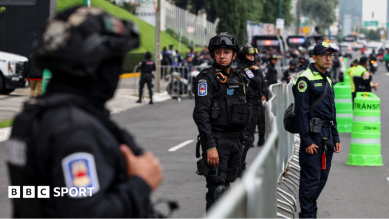 Police near the England team's hotel before their arrival for their World Cup last-16 game with Mexico in Mexico City