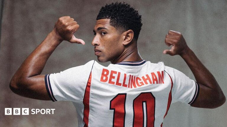 World Cup 2026: England’s Jude Bellingham return to indispensability A picture of Jude Bellingham in a publicity shot wearing an England shirt, staring at the camera.