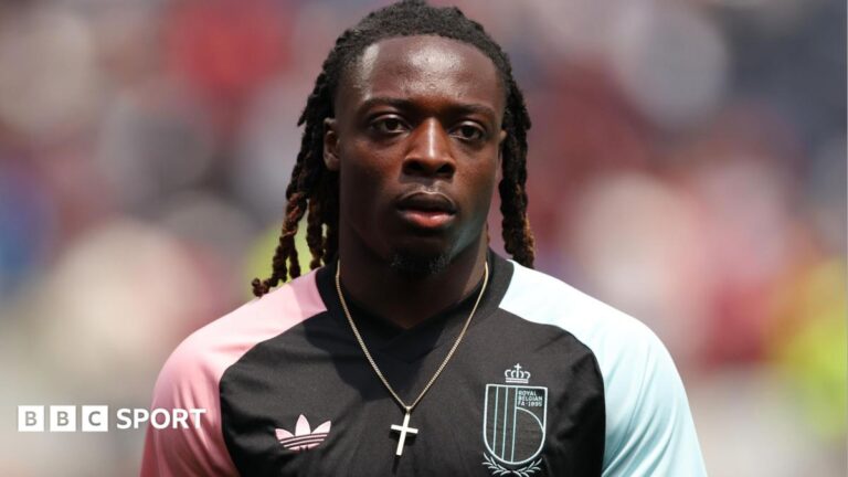 Jeremy Doku: Belgium and Manchester City winger ‘not against’ journalist who criticised him for leaving World Cup for birth of child Jeremy Doku of Belgium warms up before the FIFA World Cup 2026 Quarter Final match between Spain and Belgium