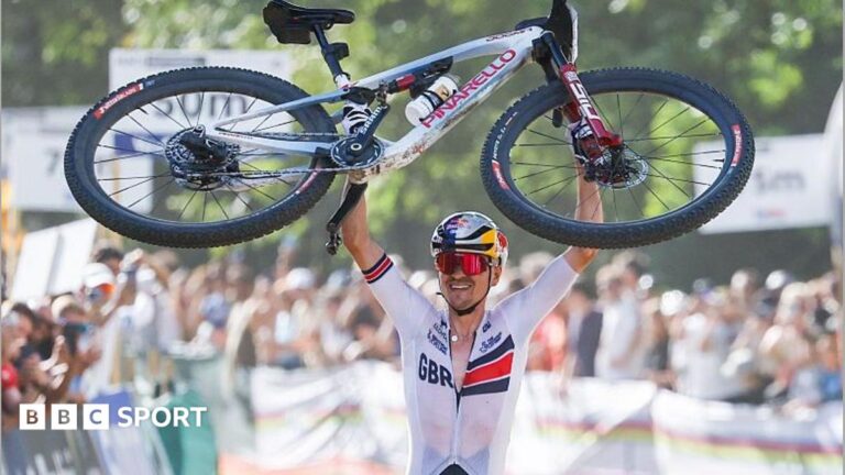 Mountain Bike World Championships: Tom Pidcock dedicates second title to Fin Tarling Tom Pidcock lifts his bike in celebration