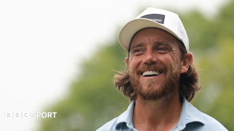 Tommy Fleetwood smiles on the first tee