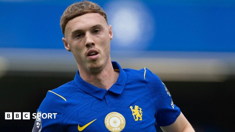 Chelsea forward Cole Palmer, wearing, the club's blue home kit, looks at the camera during a Premier League match