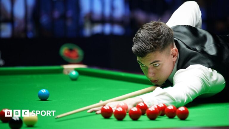 English Open: Liam Davies beats world champion Wu Yize to set up Mark Williams match Liam Davies, wearing a white shirt and black waistcoat, leans over the table to play a shot at the Wuhan Open in August
